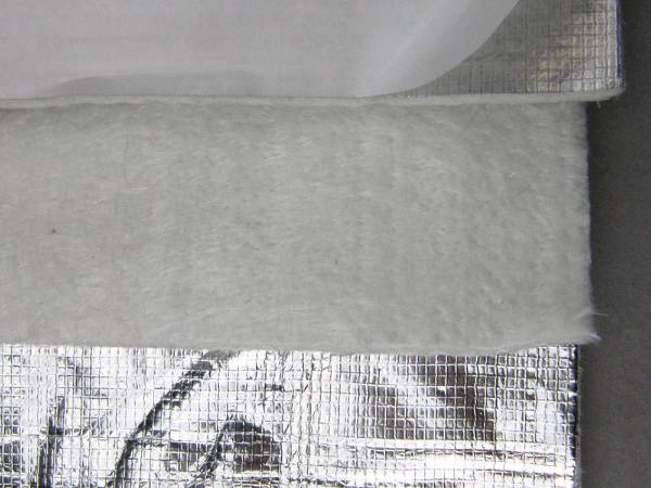 Laminated aluminum foil is made with fiberglass needle mat.